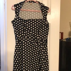 Black dress w/ white polka dots, rockabilly style.